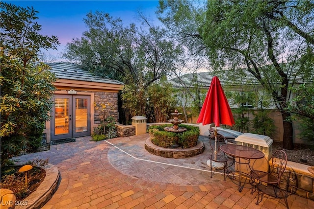 view of patio featuring french doors