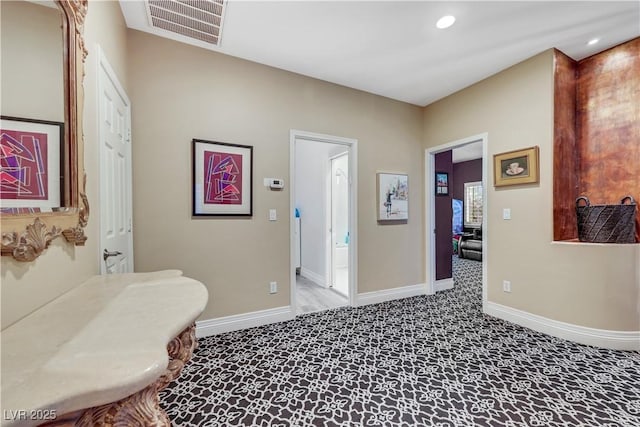 interior space with recessed lighting, visible vents, and baseboards