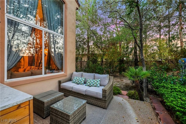 view of patio / terrace featuring fence and an outdoor living space