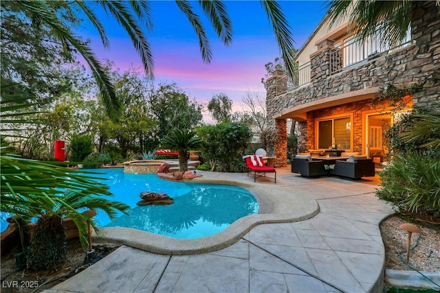 outdoor pool featuring an outdoor hangout area, an in ground hot tub, and a patio area