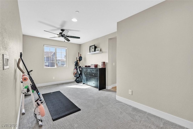 workout room with ceiling fan, carpet floors, and baseboards