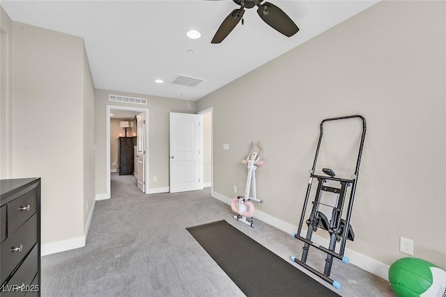 workout room featuring carpet floors, baseboards, and visible vents