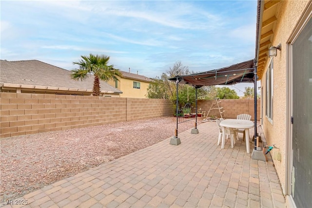 view of patio / terrace with a fenced backyard and outdoor dining space