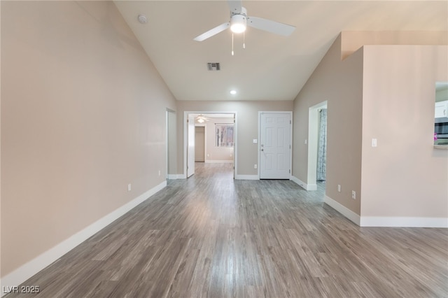 unfurnished living room featuring high vaulted ceiling, wood finished floors, a ceiling fan, visible vents, and baseboards