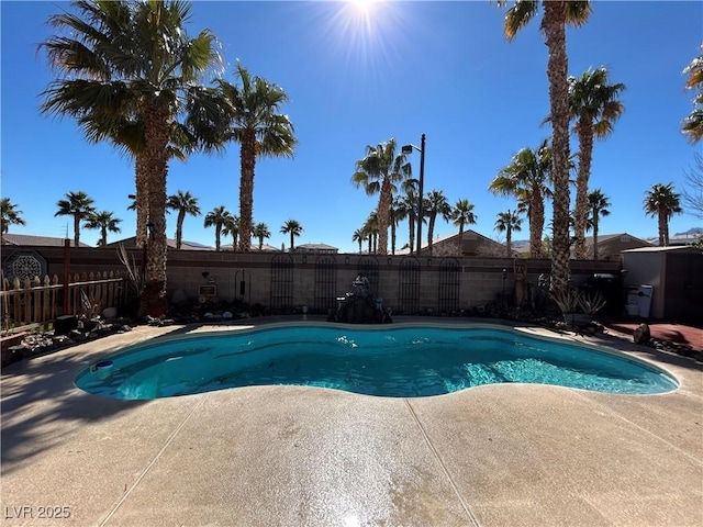 view of pool with fence, a fenced in pool, and a patio