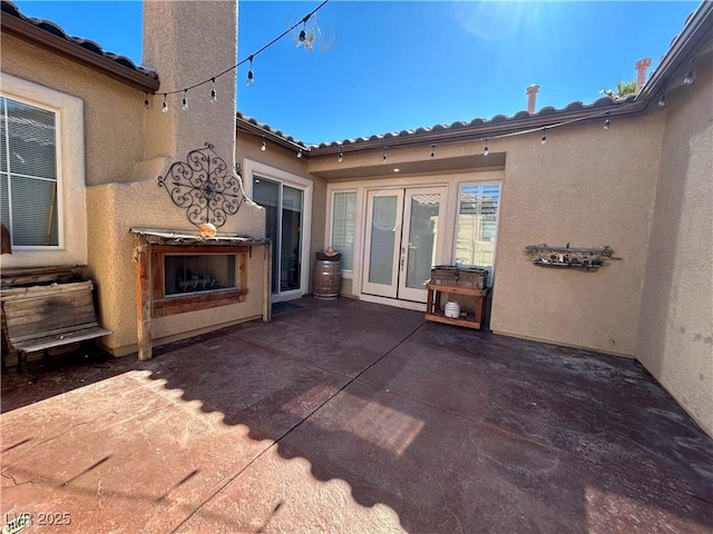 view of patio / terrace featuring an outdoor fireplace