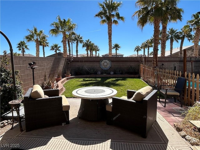 view of patio featuring a fenced backyard and an outdoor living space