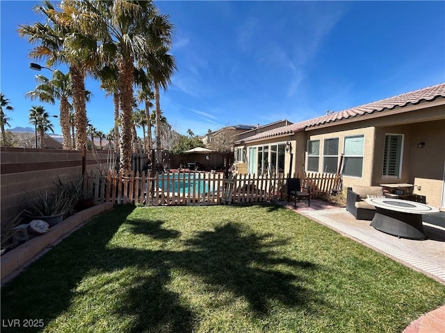 view of yard featuring a fenced in pool, a patio area, and a fenced backyard