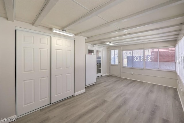 interior space with light wood-type flooring and baseboards