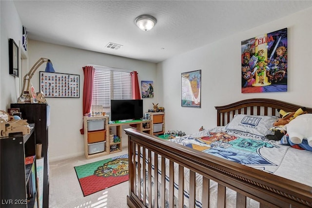 bedroom featuring baseboards, visible vents, and carpet flooring