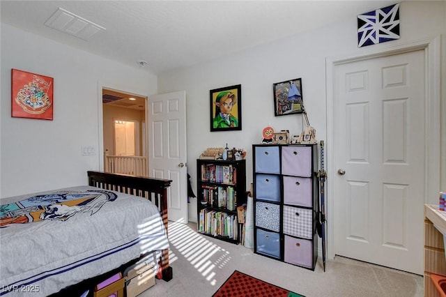 bedroom featuring carpet floors and visible vents