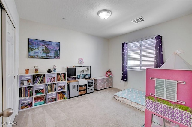 bedroom featuring carpet floors and visible vents