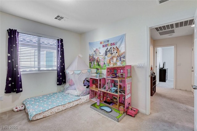 carpeted bedroom featuring visible vents and baseboards