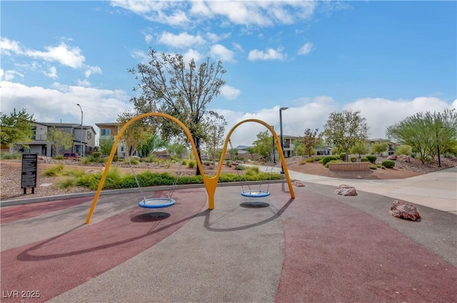 view of play area with a residential view