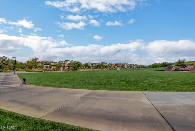 view of community with a residential view and a lawn