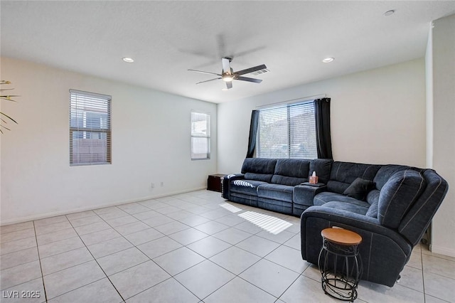 living room with light tile patterned floors, ceiling fan, baseboards, and recessed lighting