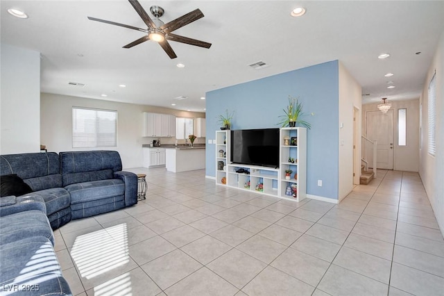 living area featuring a ceiling fan, recessed lighting, visible vents, and light tile patterned flooring