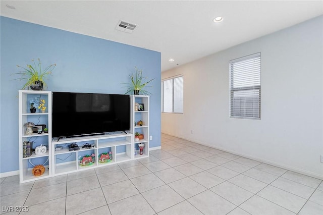 living area with light tile patterned flooring, baseboards, visible vents, and recessed lighting