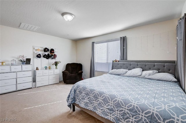 bedroom with carpet flooring and visible vents