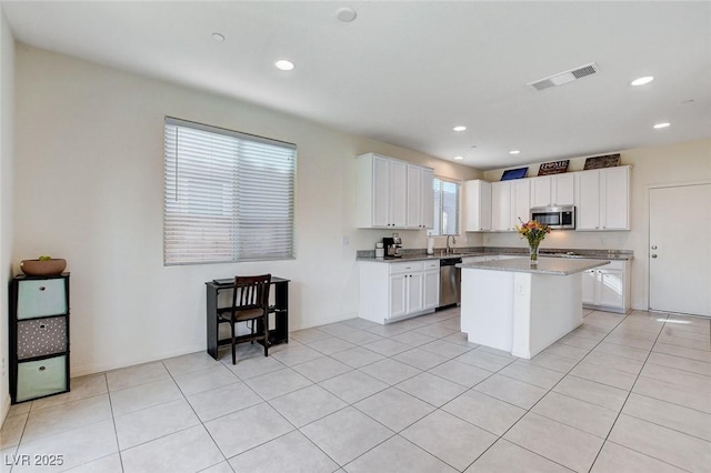 kitchen with stainless steel appliances, recessed lighting, visible vents, and white cabinets