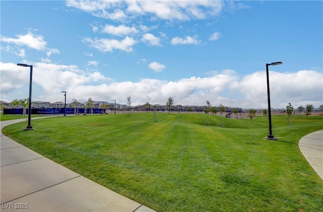 view of property's community with a yard