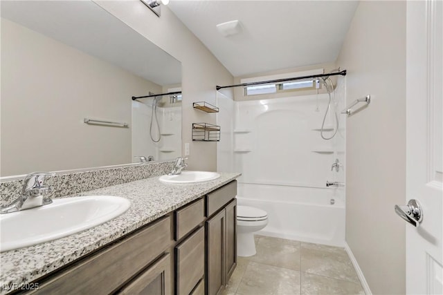 bathroom with washtub / shower combination, a sink, toilet, and tile patterned floors