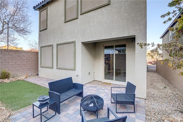 view of patio / terrace with an outdoor fire pit and a fenced backyard