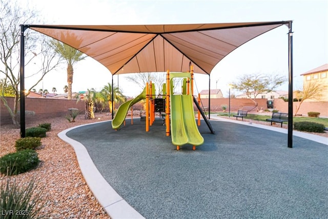 communal playground featuring fence