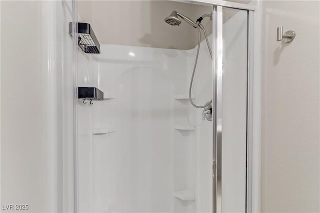 full bath featuring a shower stall