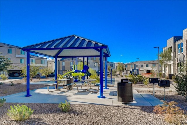 community jungle gym with a residential view