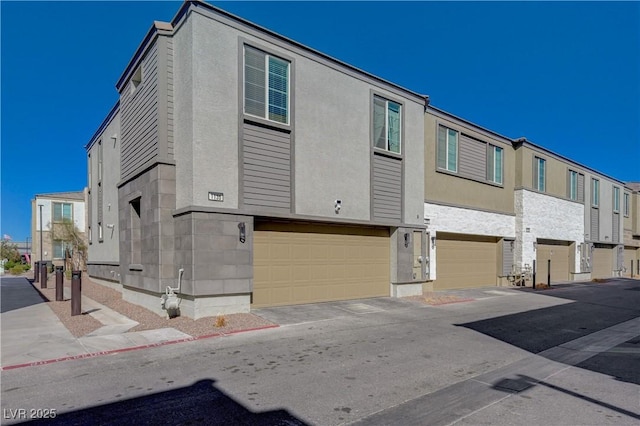 view of front facade with a garage and a residential view