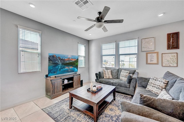 living area with a ceiling fan, recessed lighting, visible vents, and light tile patterned floors