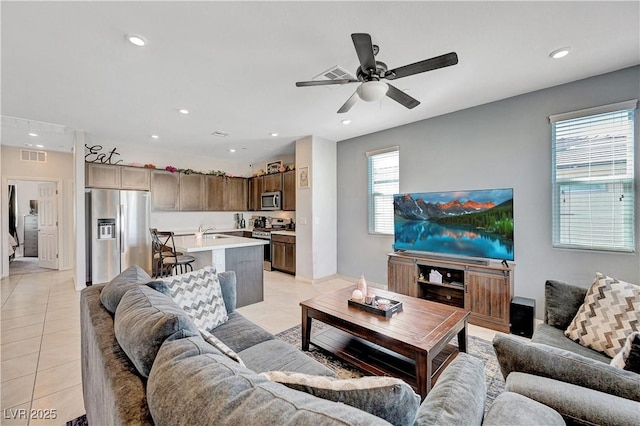 living area featuring recessed lighting, visible vents, a ceiling fan, and light tile patterned flooring