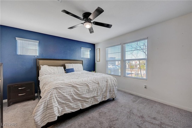 bedroom with a ceiling fan, carpet, and baseboards