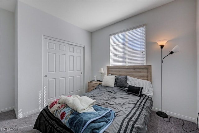 bedroom featuring carpet, a closet, and baseboards