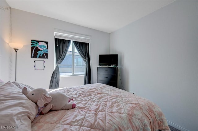 bedroom featuring baseboards