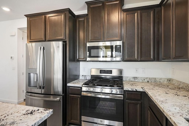 kitchen featuring light stone counters, recessed lighting, appliances with stainless steel finishes, dark brown cabinetry, and baseboards