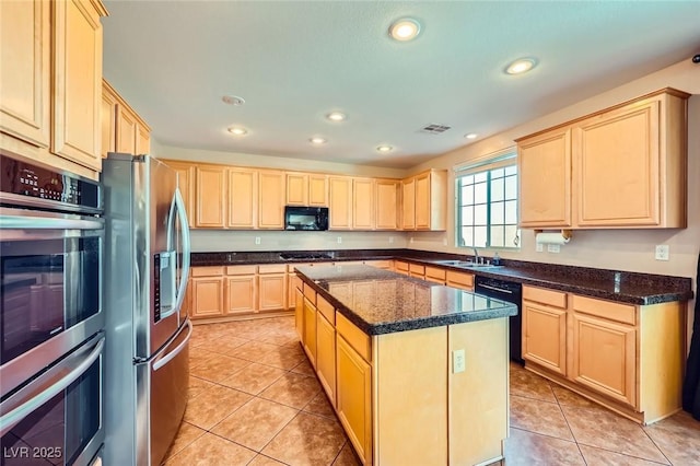 kitchen featuring black appliances, recessed lighting, light brown cabinets, and visible vents