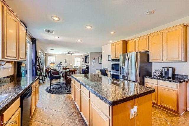 kitchen with light tile patterned floors, visible vents, recessed lighting, stainless steel appliances, and open floor plan