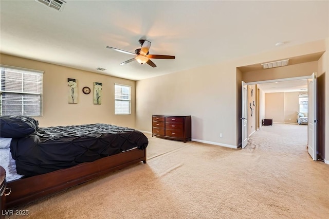 bedroom featuring light carpet, visible vents, ceiling fan, and baseboards