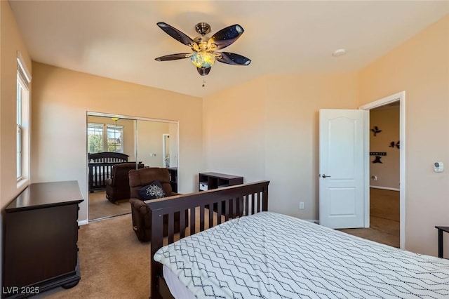 bedroom featuring a closet, a ceiling fan, and carpet flooring