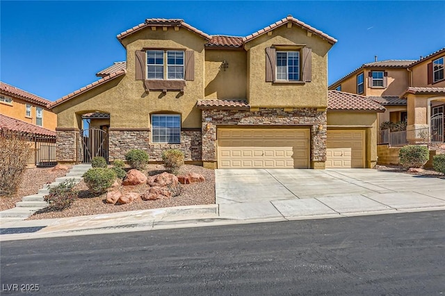 mediterranean / spanish-style house with a tiled roof, concrete driveway, stucco siding, a garage, and stone siding