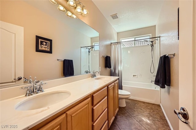 full bathroom with tile patterned flooring, double vanity, visible vents, and a sink