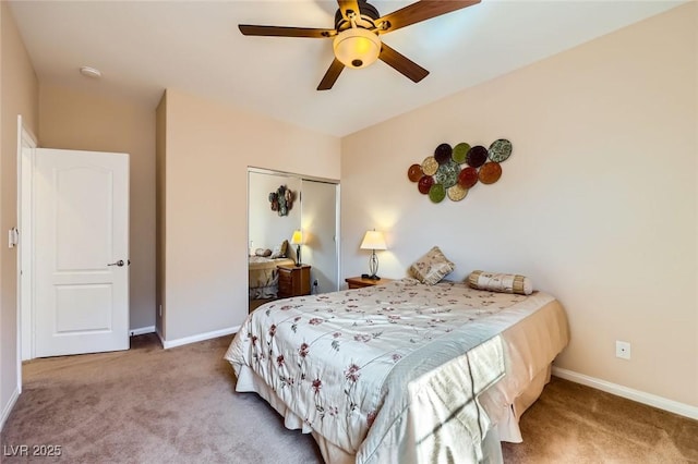 carpeted bedroom featuring a closet, baseboards, and a ceiling fan