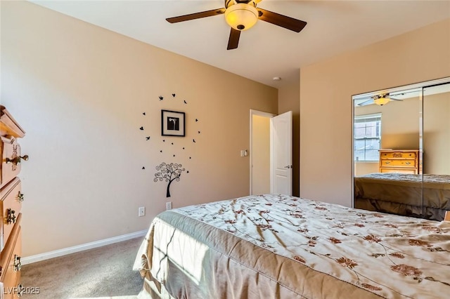 carpeted bedroom with baseboards and a ceiling fan