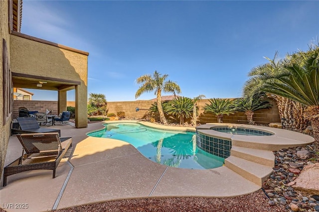 view of pool with a fenced backyard, a fenced in pool, an in ground hot tub, and a patio