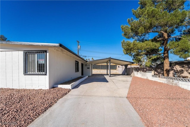 view of property exterior featuring fence