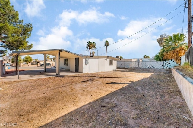 back of house featuring a patio area and fence