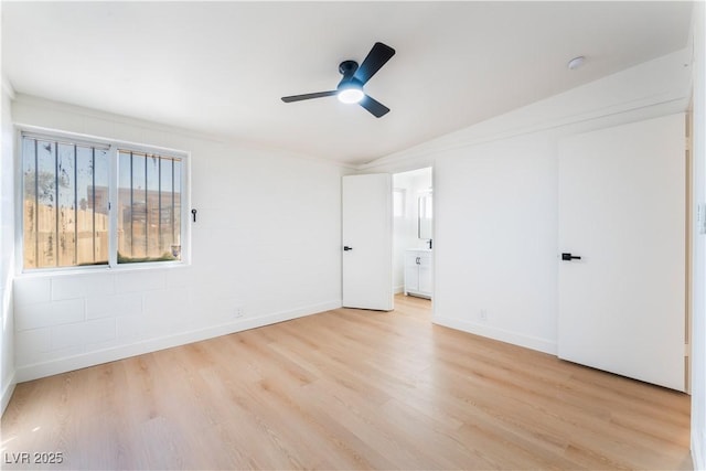 unfurnished bedroom with connected bathroom, light wood-style flooring, baseboards, and ceiling fan