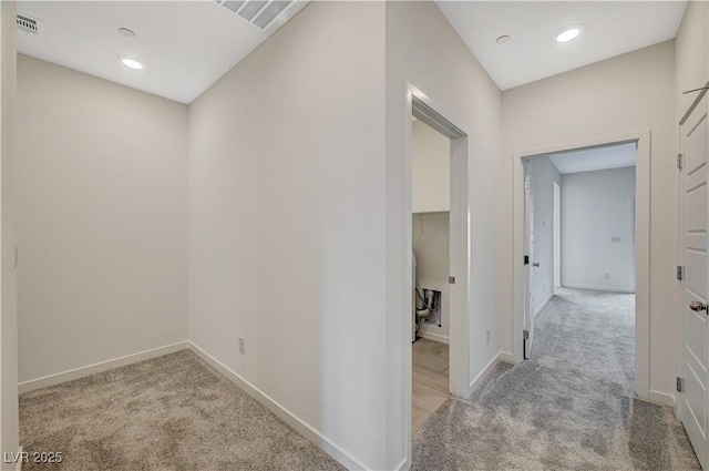 corridor with carpet, visible vents, baseboards, and recessed lighting